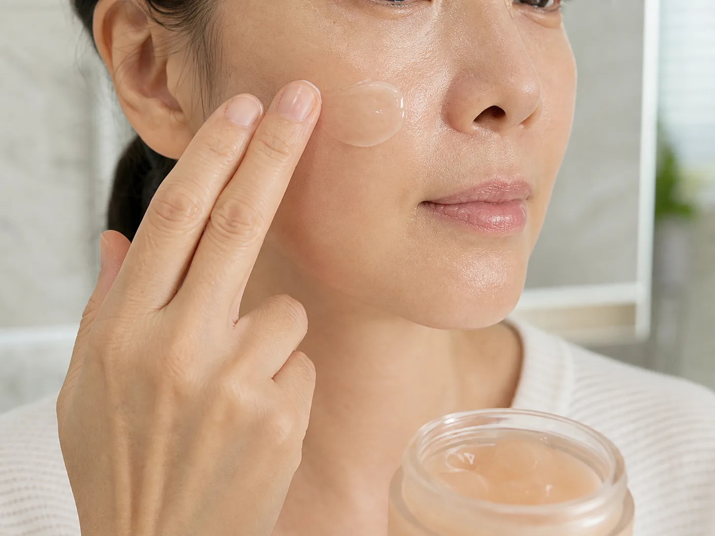 Adenosine product texture being applied to skin