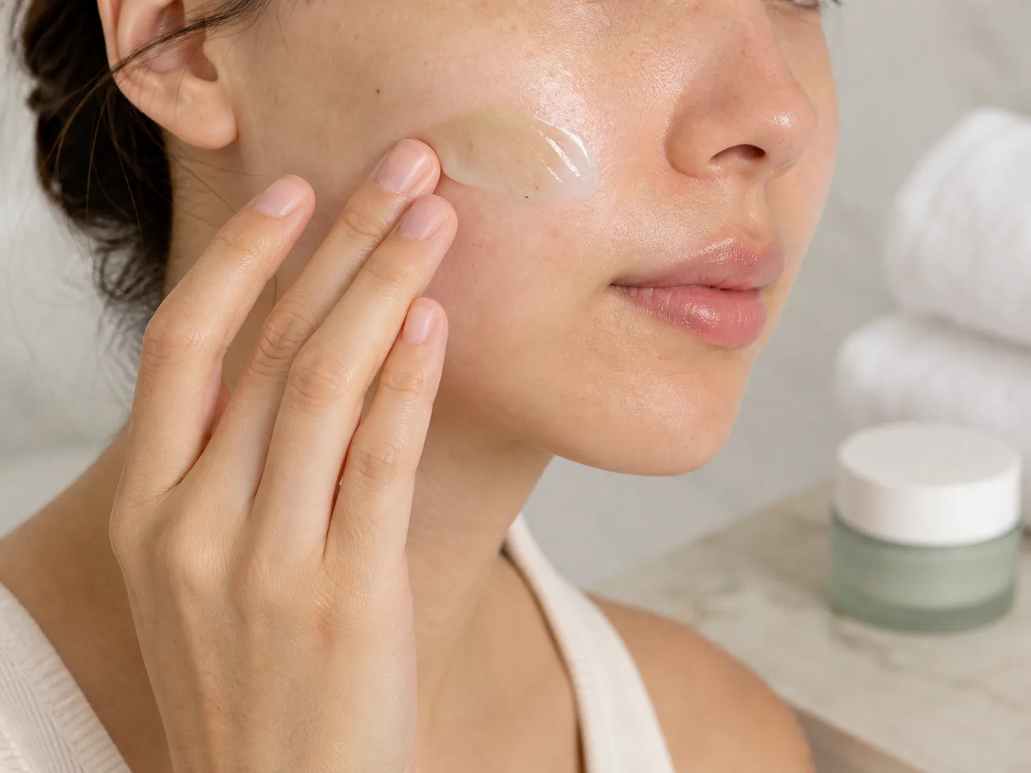 Malachite Extract product texture being applied to skin